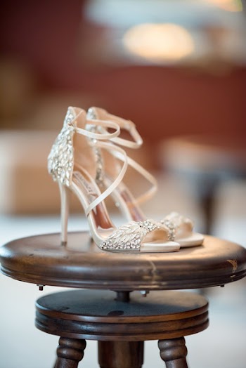 Pair of Silver Leather Open-toe Ankle Strap Sandals on Stool