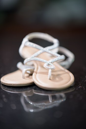 Pair of White T-strap Sandals