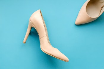 Pair of Woman's Beige High Heels Shoes
