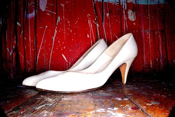 pair of women's white kitten heels