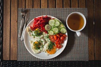 Paleo breakfast eggs with vegetables outside 