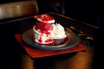 Pancake With Cream and Cherry Syrup on Top