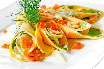 pancakes with caviar and salad