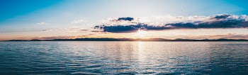 Panoramic Photo of Body of Water During Golden Hour