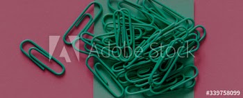 Paperclips on a piece of paper