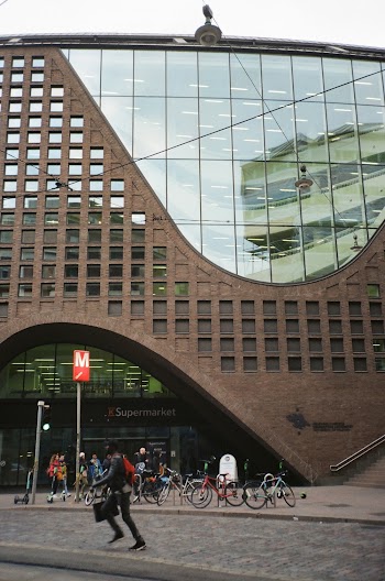 Parked Bike In Front Of A Brown Building
