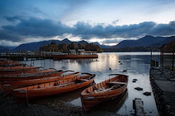 parked boats on body of water