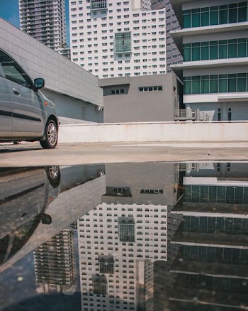 parked gray car near building