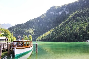 Parked Passenger Boat on Body of Water