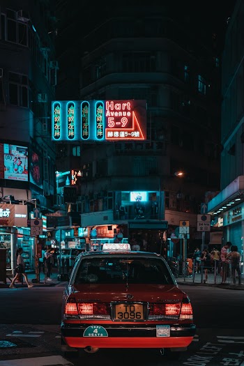 Parked Red Vehicle during Nighttime
