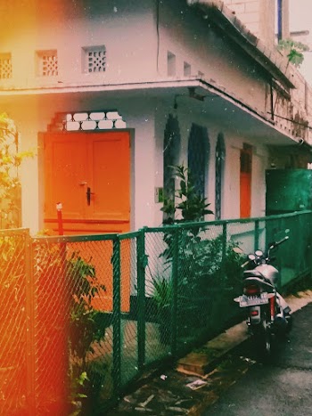 Parked Standard Motorcycle Beside House