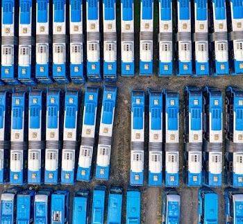 Parked White-and-blue Bus