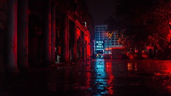Parking Area With Reflection Of Red Light