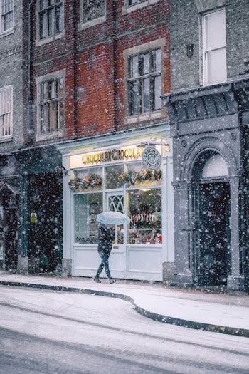 parson walking near cafe during winter