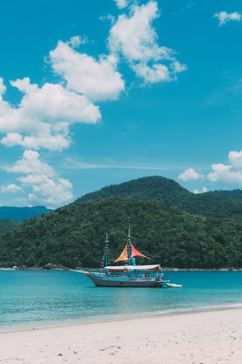 Passenger Boat on Body of Water