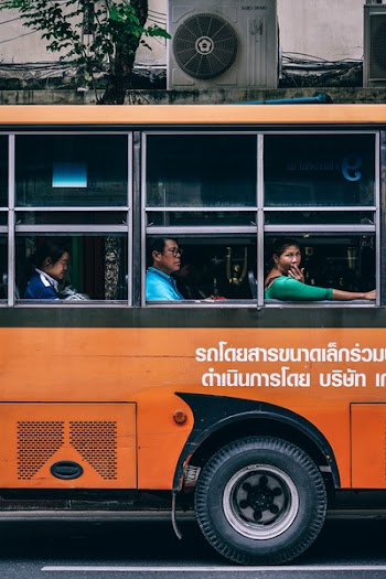 Passengers Inside the Orange Bus
