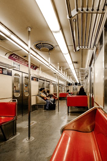Passengers Sit Inside the Train