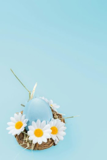 Pastel Blue Easter Egg in Floral Nest