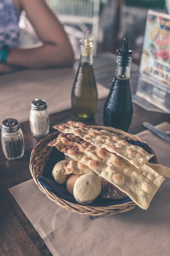 Pastries On Brown Wicker Basket Near Condiments