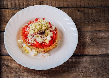 Pastry With Cream in Ceramic Saucer