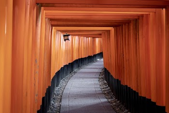 Pathway Along a Red and Black Archway
