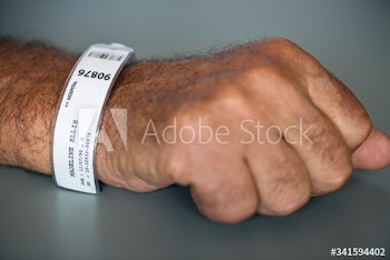 Patient earing an identification wristband in the intensive care unit