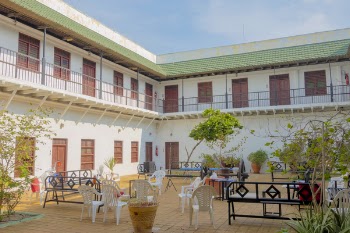 Patio Benches and Chairs Outside 2-storey Building