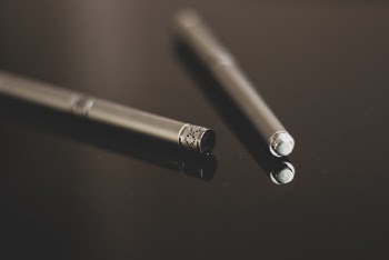 Pen on Black Surface