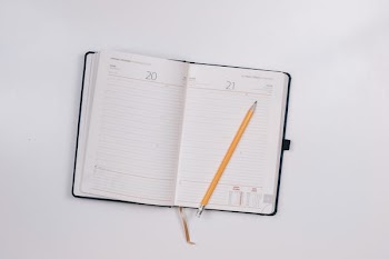 pencil on opened notebook