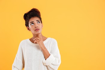 Pensive lady looking up and thinking isolated Free Photo