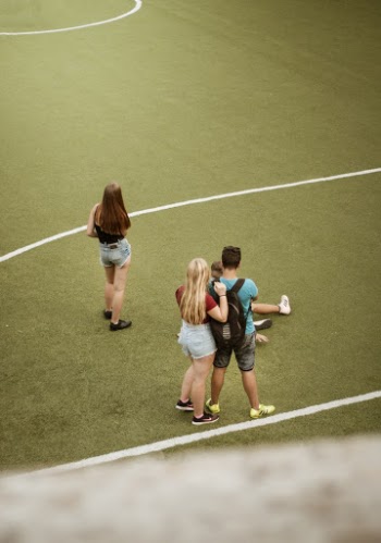 People  and Man Standing on A Court