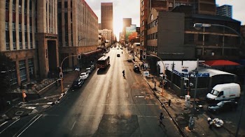 people and vehicles passing through the road