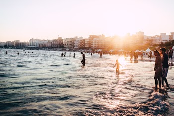 People At The Beach During Golden Hour