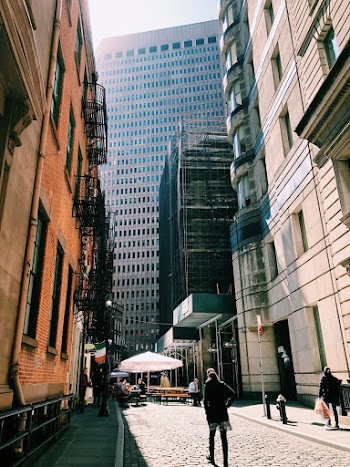 People at the Road Between Buildings during Day