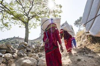 people carrying Lokta bark paper | Free Photo - rawpixel