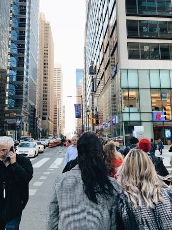 People Crossing on Street Near Building