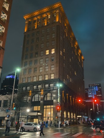 People Crossing Street during Nighttime
