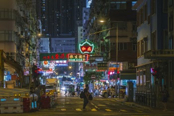 People Crossing Street during Nighttime