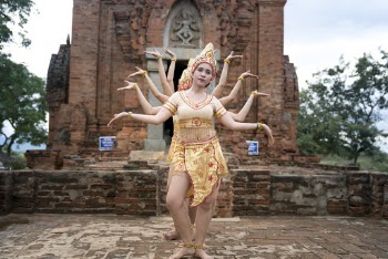 People Dancing Beside Concrete Temple