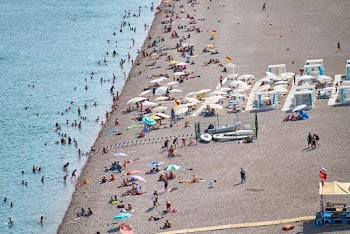 People Enjoying The Beach