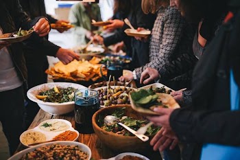 People feasting on healthy salad buffet 