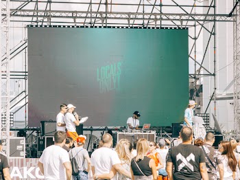 People Gathered in Front of Stage