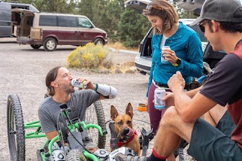People Having a Conversation While Drinking Canned Beer