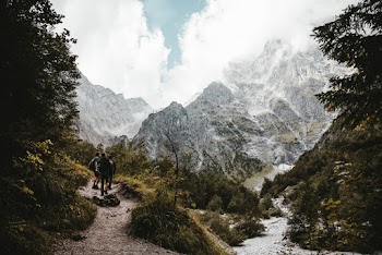 People Hiking Near Mountains