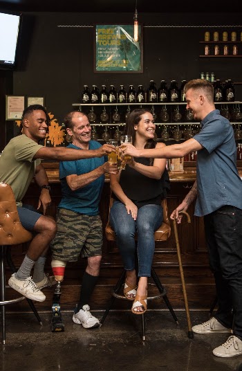 People Holding Glasses Inside Bar
