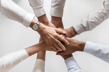 people holding hands together