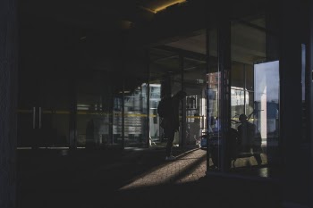 People in a Building With Glass Walls