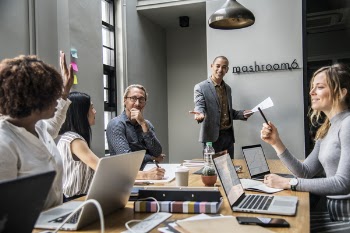 People in a Mashroom 6 Conference Room