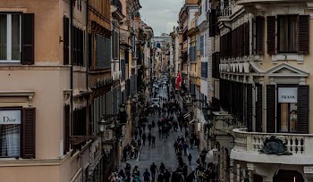 people in between two buildings at daytime