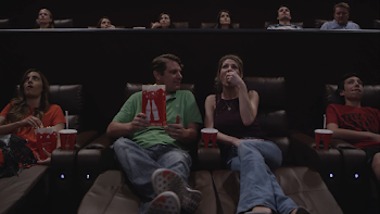 People in movie theater eating popcorn Stock Video Footage ...